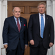 Former New York City Mayor Rudy Giuliani stands with then President-elect Donald Trump on Nov. 20, 2016, in Bedminster Township, N.J.